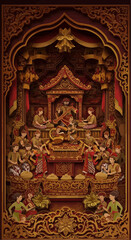 Intricate Indonesian wood carving depicting a royal ceremony with musicians and figures.