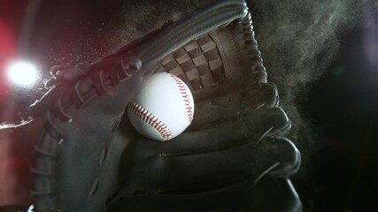 Super slow motion of hand in brown leather baseball glove caught ball isolated on black background . Filmed on high speed cinematic camera - Powered by Adobe