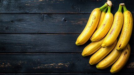 Bunch of bananas on dark wood