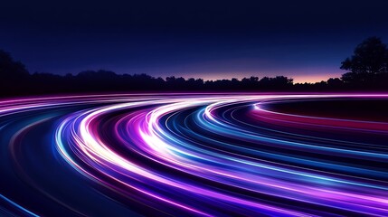 Winding road at night with streaks of light
