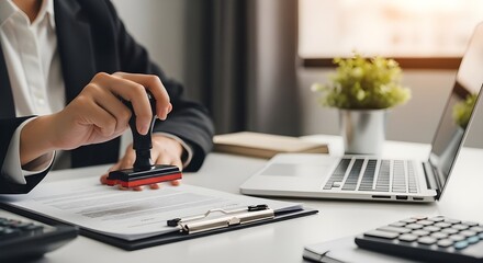 Document Approved with Official Stamp on Desk with Laptop and Calculator | Business Certification, Legal Agreement, Banking, and Contract Approval for Finance and Law