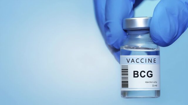 Doctor in protective gloves holding a BCG (tuberculosis) vaccine. Kids vaccine. The concept of medicine, healthcare, science and vaccination awareness