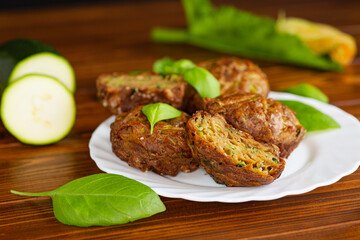 Zucchini muffins on a dark wooden table