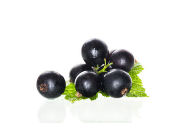 some blackcurrant berries isolated on white background