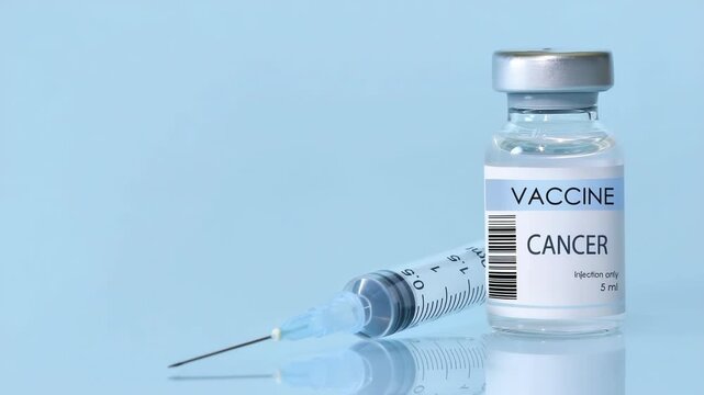 Cancer Vaccine in a bottle with a syringe on a blue background. Experimental cancer vaccine vial for immunization against Cancer disease.Copy space - Powered by Adobe