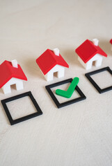 Select one of the houses with a green check mark. Choosing the most suitable property. Real estate...