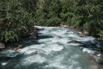Mountain Turgen river flowing through forest landscape in Kazakhstan
