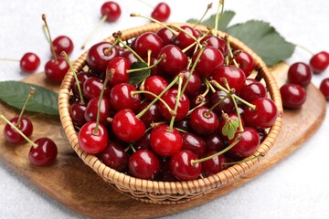 Fresh ripe cherries on light table, closeup