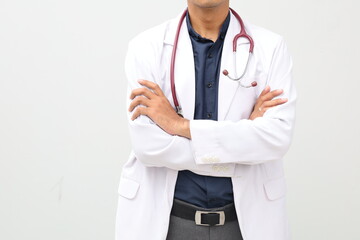 Close up photo of Asian adult man body in doctor's coat posing folded arms. Man doctor isolated white background
