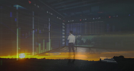 Examining white shirt executive analyzing market data on screens in control room, with sunset