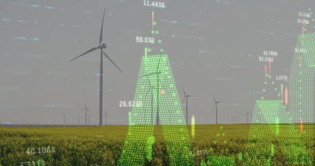 Displaying large white wind turbine rotating over yellow crop field, with green digital data charts