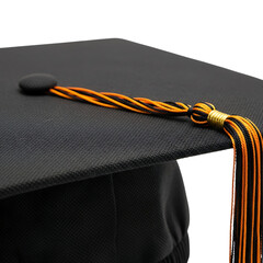 Close-up of Black Graduation Cap with Orange and Black Tassel; Achievement, Success, Education Concept