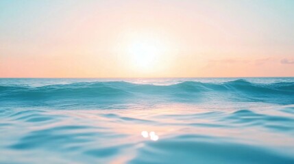 Fototapeta premium A serene ocean scene at sunrise- with gentle waves and soft pastel colors. The focus is on the water's surface reflecting the sky- creating an abstract pattern of light blue hues.