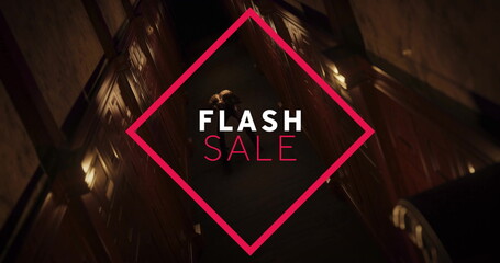 Walking adult male wearing overcoat in hotel corridor, with red diamond-shaped FLASH SALE graphic