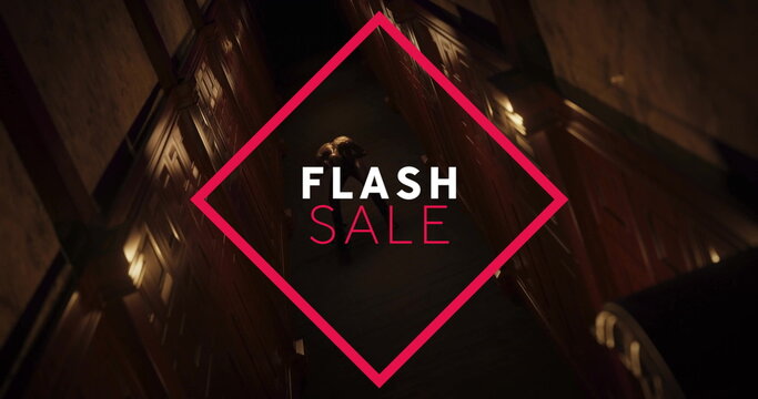 Walking adult male wearing overcoat in hotel corridor, with red diamond-shaped FLASH SALE graphic - Powered by Adobe
