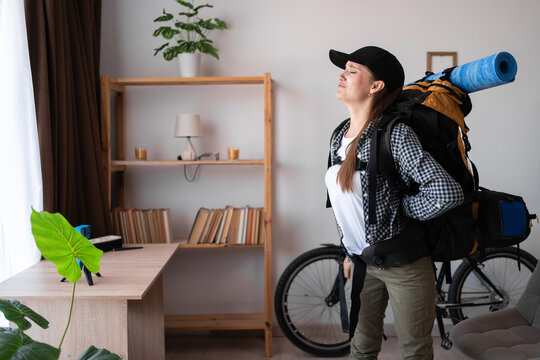 Traveler woman with backpack ready to trip suffering pain body muscles stiff problem - Powered by Adobe