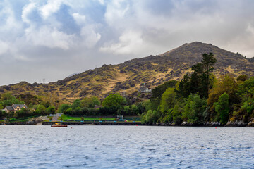 Bay near Glengarriff, Ireland, mountains with houses in background, original Irish landscape