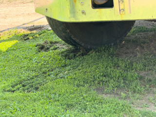 A truck damaging the grass