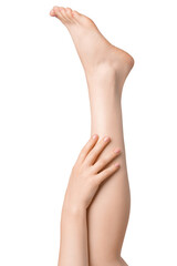 Woman's legs with hand isolated on white background. Well-groomed toes.