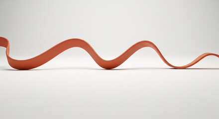 A wavy orange rubber band on a white background shot