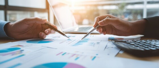 The collaboration of professionals analyzing financial data with charts and reports.