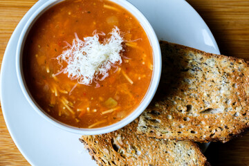Italian Style Minestrone Soup Topped With Cheese Seved With Toast