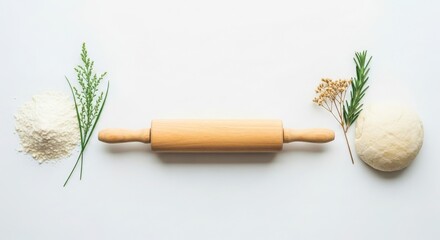 Baking essentials flour dough rolling pin and fresh herbs on a white background