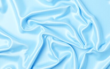 Obraz premium Light blue silky satin fabric with fluid folds on white acrylic base, soft top-down angle with cool lighting for elegant textile photography
