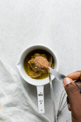 Overhead view of Brown sugar in a spoon, top view of light brown sugar