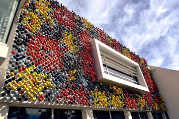 Black, Red and Yellow spheres on the building facade
