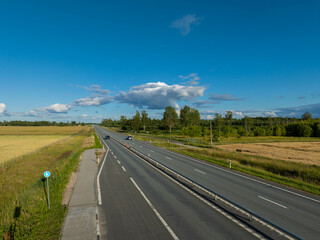 Aerial view of Tallinn-Tartu highway on a sunny summer evening. Tartu county, Estonia. 