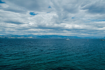 Serene Seascape with Yacht and Sailboat
