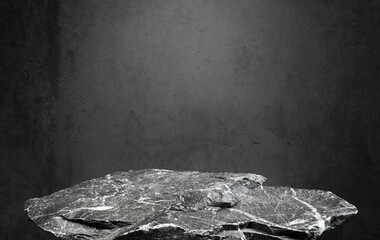 stone granite podium at foreground with Black concrete background and light from above. Product...