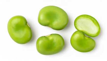 Overhead shot of five fresh, green fava beans, one cut in half, against a plain white background.