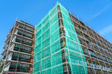 Multi-story building facade thermal insulation installation and renovation, scaffold and netting