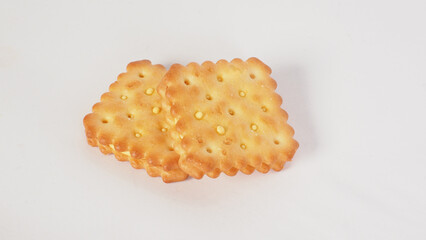 Cheese crackers with a golden brown color on white background
