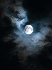 Eerie Sliver of a Bright Moon in a Dark Sky