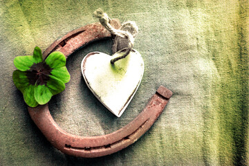 Decoration with four leaf clover and horseshoe place for text	