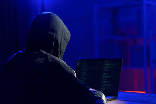 Hacker launching cyberattack targeting data systems and exposing cybersecurity vulnerabilities