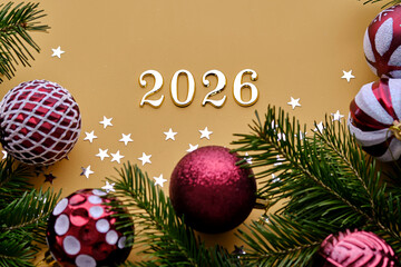 Yellow New Year's background with the number of the coming year 2026.