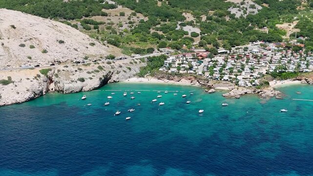 Campsite at Campig Skrila, Krk Island, Stara Baska Croatia, Aerial View of the Mountains and Coast With Boats, Beaches and Adriatic Sea.  The Seaside Rv Campmobiles on a Summer Beautiful Coastline