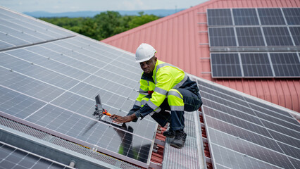 Service engineer checking solar cell on the roof for maintenance if there is a damaged part....