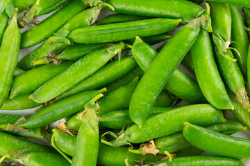 Fresh green pea pods with green peas isolated on white background. Sweet green peas. Green pea beans vegetables. Vegan. healthy vegetable