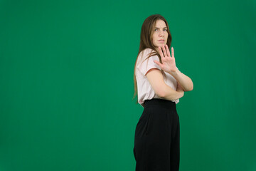Stop. Concerned Asian woman showing refusal sign, saying no, raise awareness, standing different...