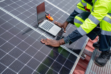 Service engineer checking solar cell on the roof for maintenance if there is a damaged part....