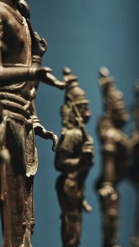 Row Of Old Ancient Bronze Figurines Of Indian Deities And Avatars. 18-19th Century Ce. Close-up View On Vamana Avatara