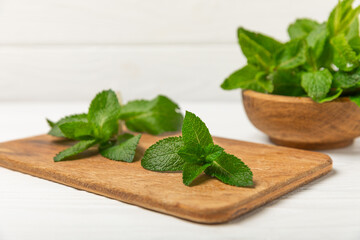 Mint. Fresh organic mint leaves on wooden background. Mint leaves. Peppermint. Close-up. Space for text. Copy space.