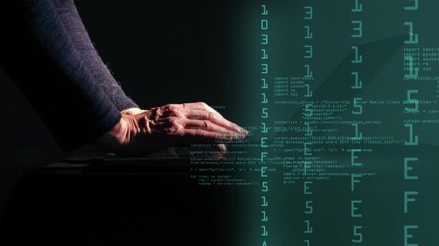 Hands typing on laptop in dark room with computer code overlay animation