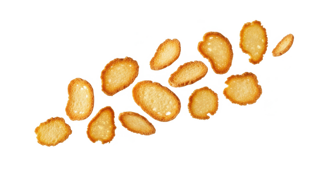 A collection of golden-brown, crispy croutons arranged against a plain white backdrop.