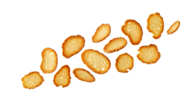 A collection of golden-brown, crispy croutons arranged against a plain white backdrop.